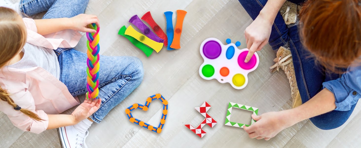 Kids playing with Butterfly Dimple, wacky track, snake cube, marble and mesh, and monkey noodles